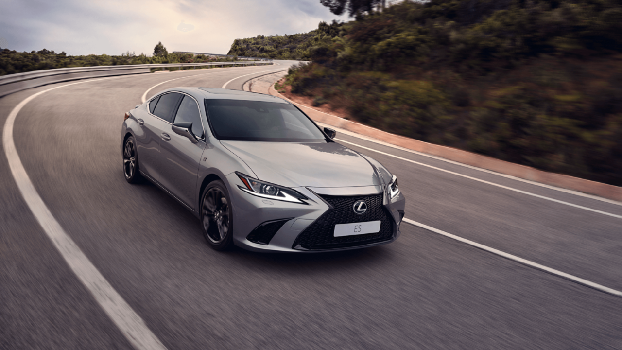 A Lexus ES driving on a road