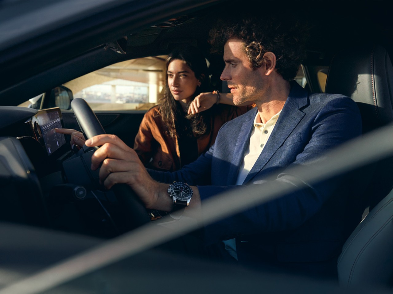 Two people sat in a Lexus NX