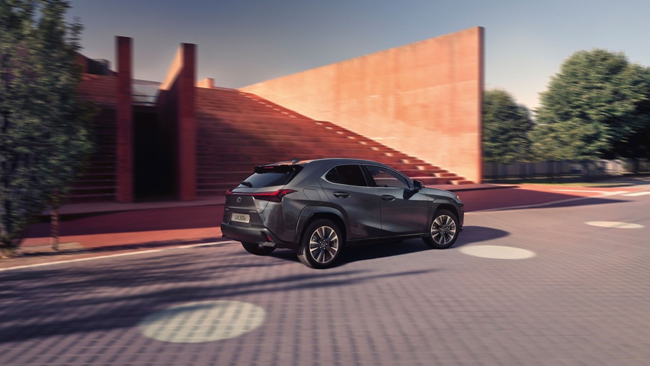 A Lexus UX 300e driving on a road