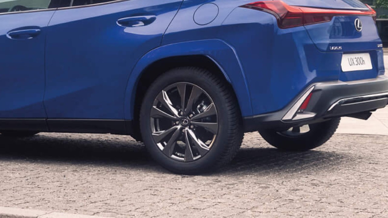 Side view of a blue Lexus UX